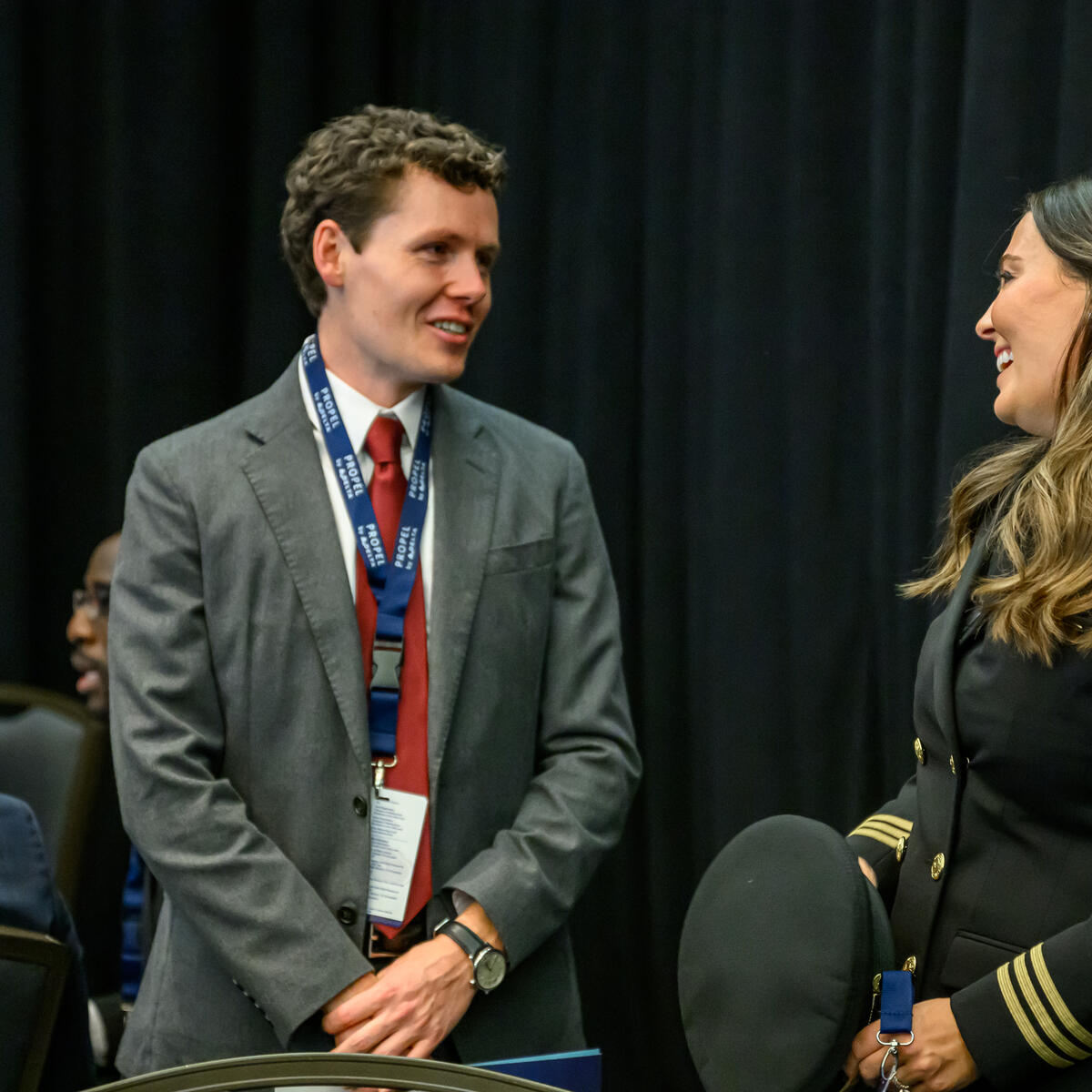 Delta employee Michael Hulse speaks with Samantha Warren, a Delta pilot and the very first Propel Company graduate.