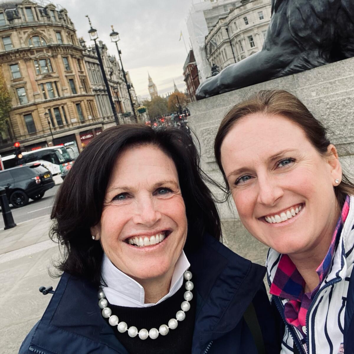 A mother and daughter duo who have nearly 30 years of combined service at Delta pose for a selfie in London.