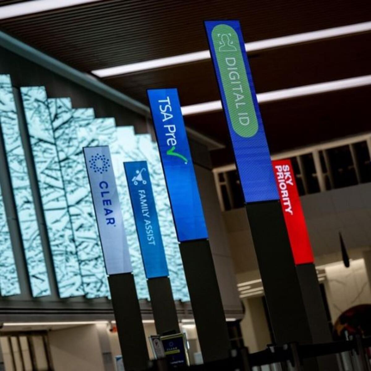 An airport with different check ins, including Delta's Digital ID.