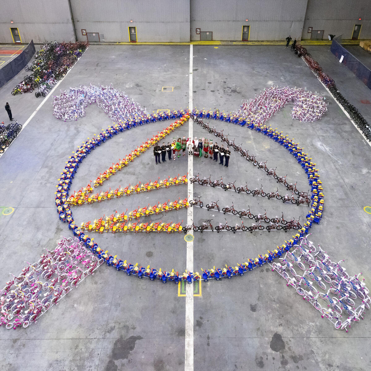 Leading up to the Delta TechOps Toys for Tots event, pink and blue bikes lined the halls of the TechOps facility and bikes were assembled in the shape of the Delta Widget with candy canes around it.