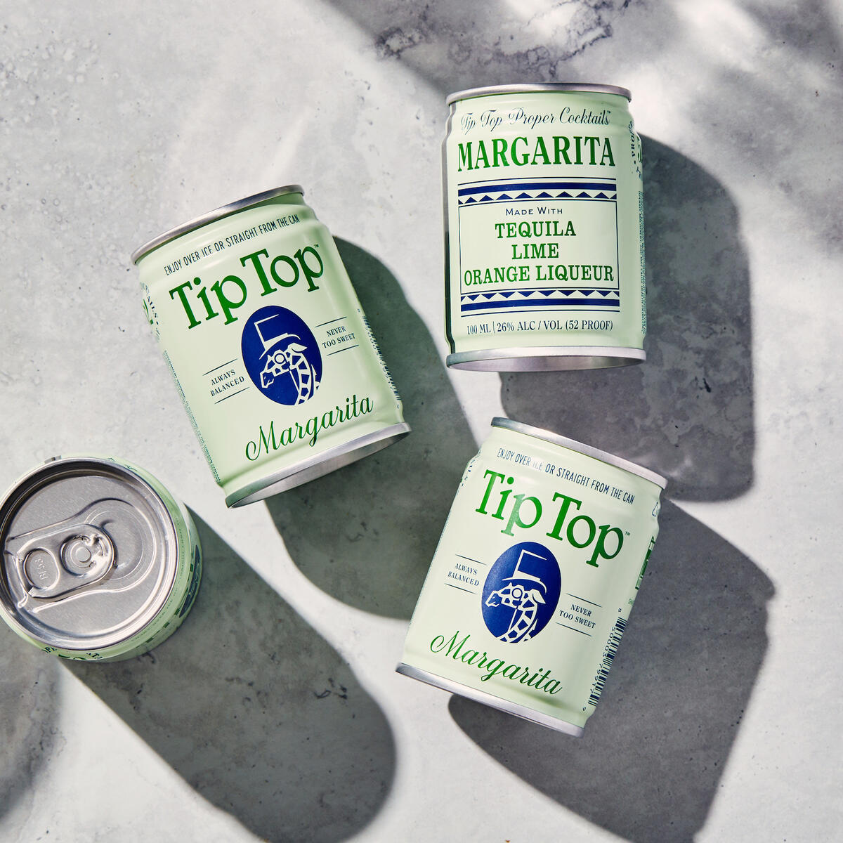 A flatlay of TipTop Margarita cans