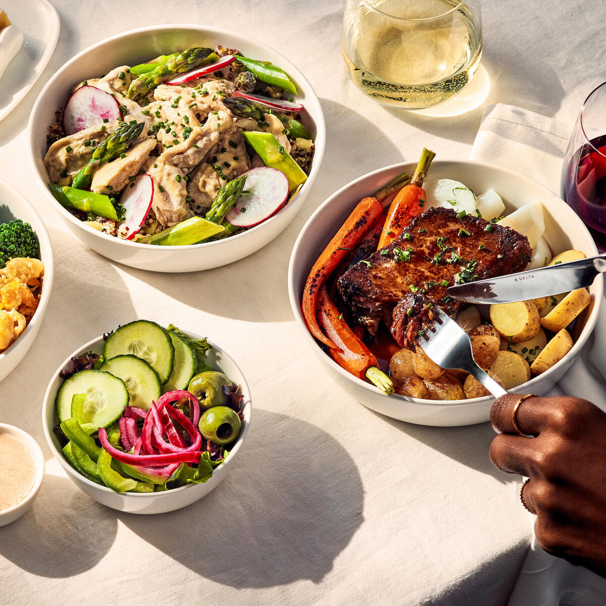 Starting this February, domestic First Class customers departing from Atlanta on flights offering our signature meal service will have lunch and dinner entrée options that include beef short ribs from Atlanta-based Fox Bros. Bar-B-Q; glazed smoked chicken with quinoa salad; or baked mac-n-cheese with toasted garlic breadcrumbs and broccoli. End with a delicious whipped cream-topped lemon bar for a sweet finish to your meal.