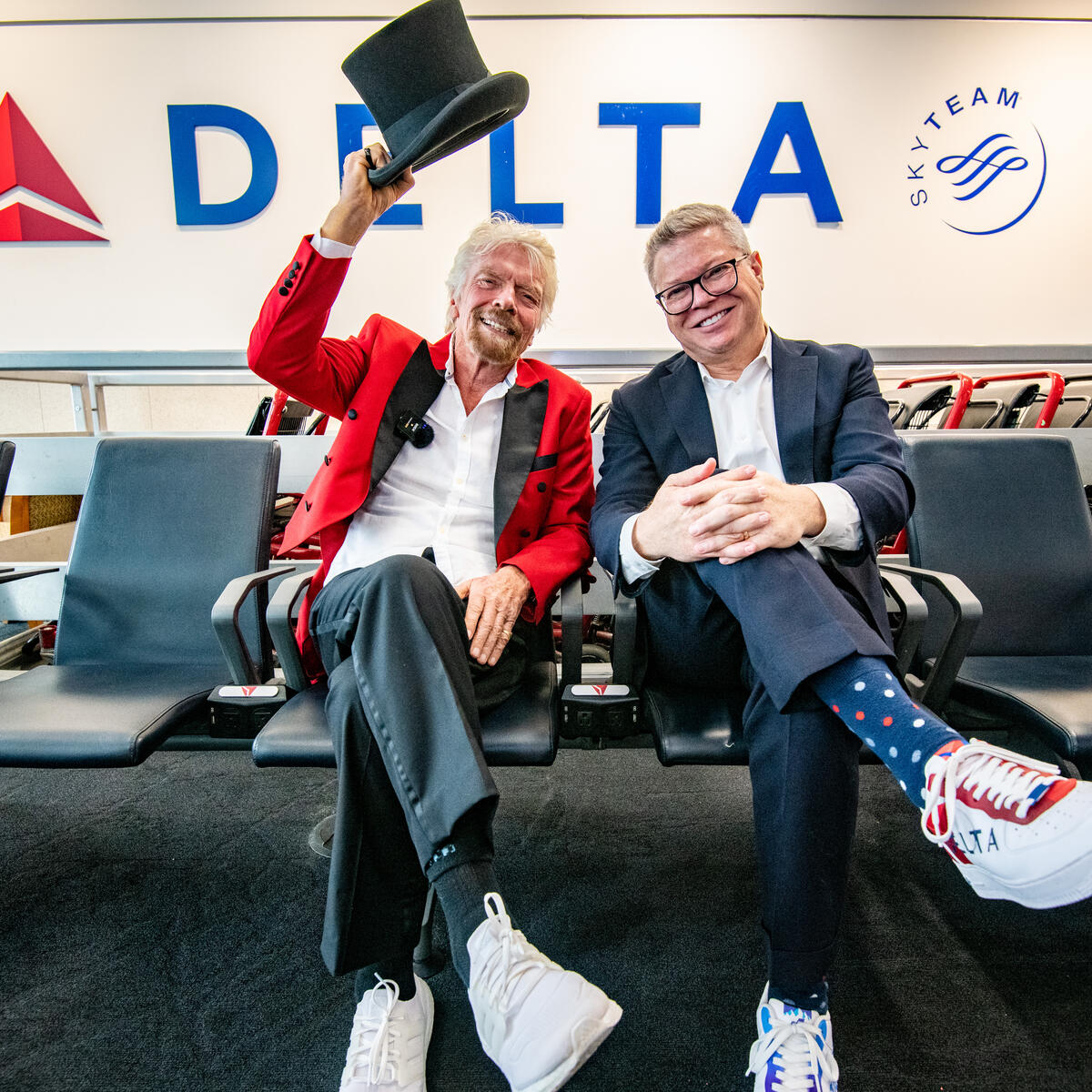 Sir Richard Branson and Delta Chief Marketing & Communications Officer Tim Mapes post for a photo during an event with Virgin Voyages.