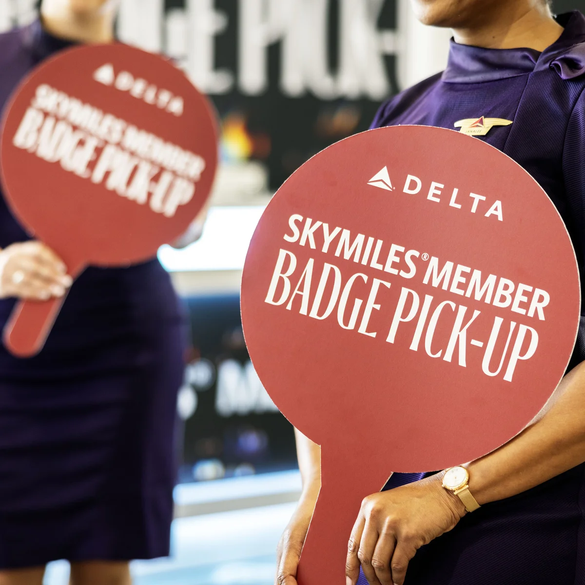 Austin-based flight attendants and Red Coats assist in assisting guests with a dedicated badge pick-up area for SkyMiles Members at the Austin Convention Center Rotunda Foyer during SXSW 2024.