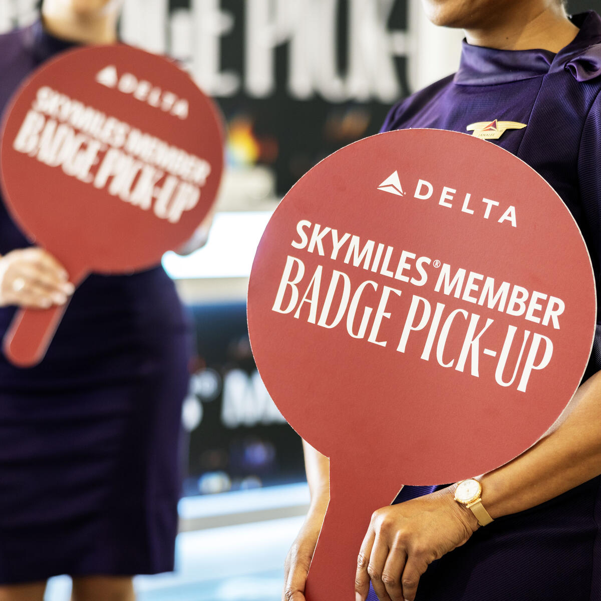 Austin-based flight attendants and Red Coats assist in assisting guests with a dedicated badge pick-up area for SkyMiles Members at the Austin Convention Center Rotunda Foyer during SXSW 2024.