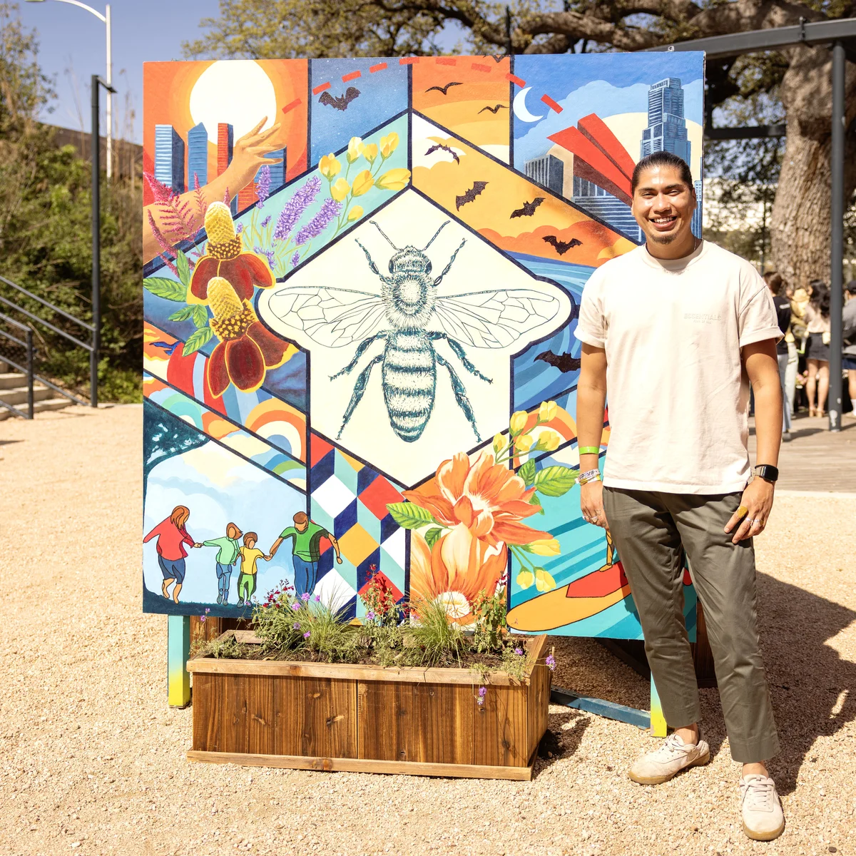 Ruben Esquivel of&nbsp;East End Eclectic&nbsp;stands next to a mural he co-designed with Kat Talley and Delta Air Lines. The mural will be utilized as part of Waterloo Greenway's annual Artist in Residence program with East End Eclectic through the summer and highlighted during spring and summer as part of Waterloo Greenway’s environmental and art programs.&nbsp;