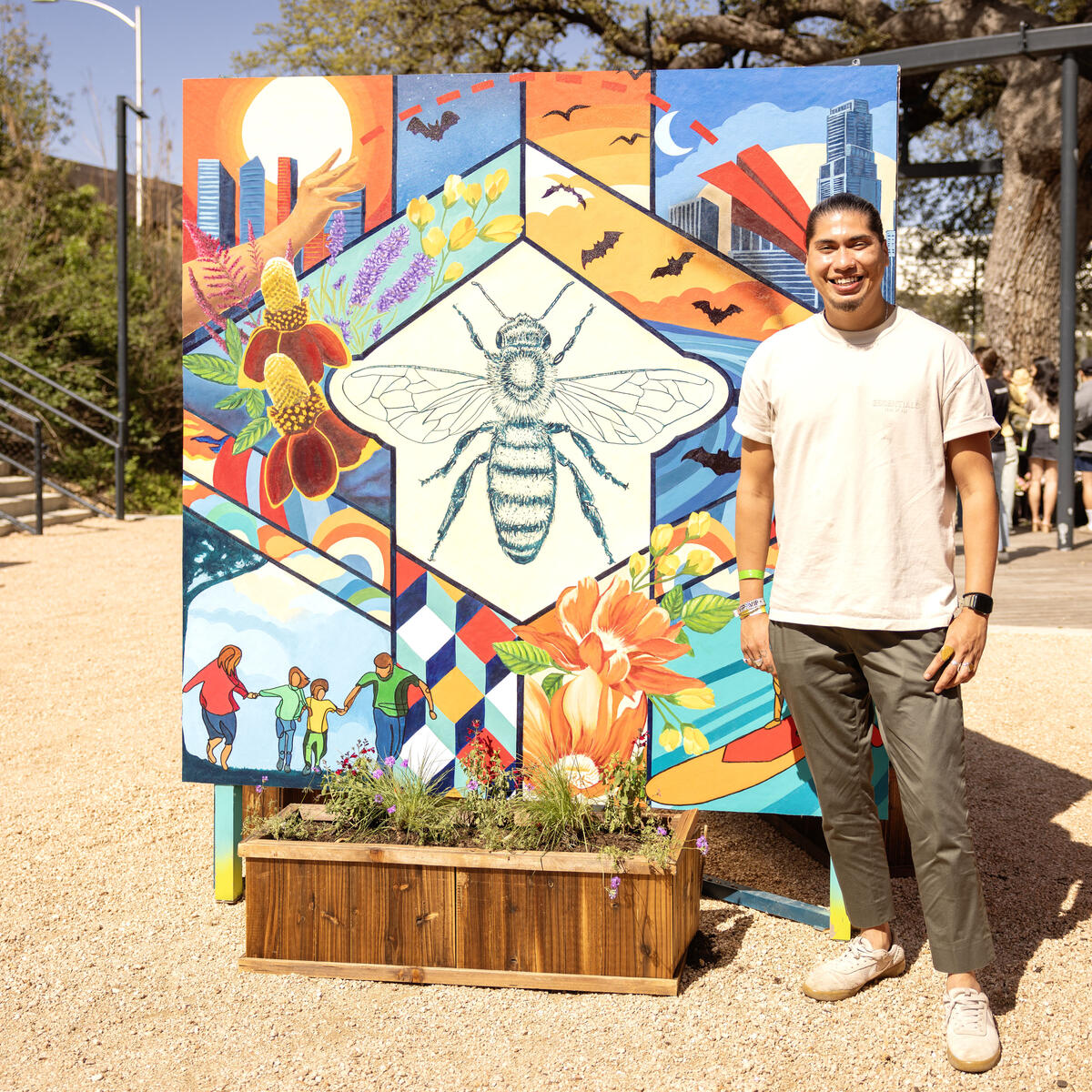 Ruben Esquivel of&nbsp;East End Eclectic&nbsp;stands next to a mural he co-designed with Kat Talley and Delta Air Lines. The mural will be utilized as part of Waterloo Greenway's annual Artist in Residence program with East End Eclectic through the summer and highlighted during spring and summer as part of Waterloo Greenway’s environmental and art programs.&nbsp;