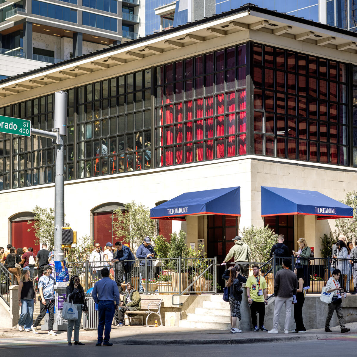 Visitors eagerly wait to enter the Delta Lounge, a branded pop-up experience exclusively for SkyMiles members featuring fast, free Delta Sync Wi-Fi, global fan-favorite beverages from Delta partner Starbucks, custom limited-edition Delta x SXSW merch, and more.&nbsp;&nbsp;