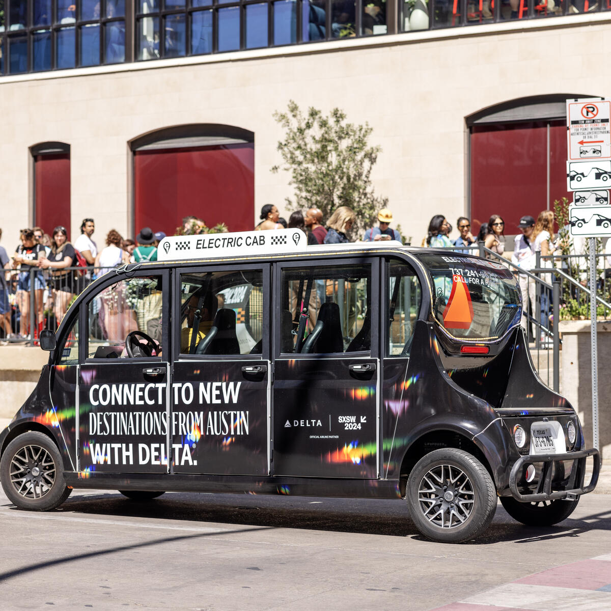 An electric Delta-branded hopper transports members looking for a ride throughout downtown Austin. The hoppers were available throughout the duration of SXSW 2024, with complimentary rides to the Austin Convention Center, the Delta Lounge or any local downtown destination.