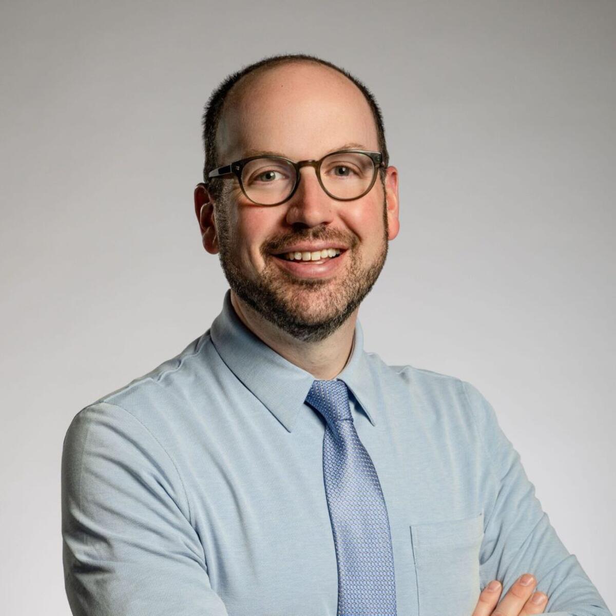 A headshot of Ekrem Dimbiloglu, Delta Air Lines’ Managing Director of Customer Experience, Delta Studio & Wi-Fi