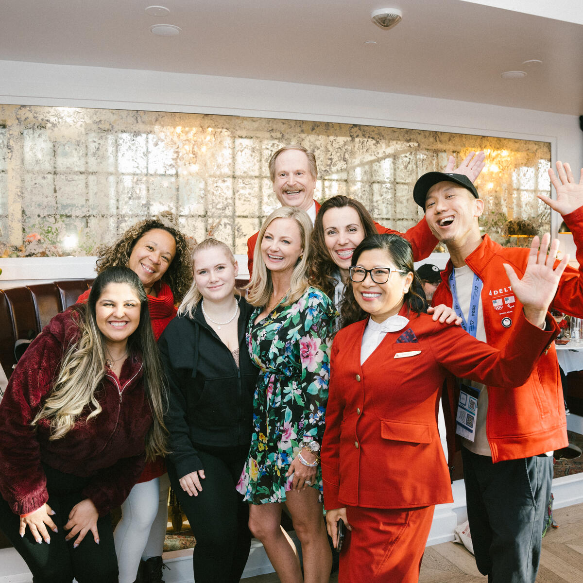 Delta flight attendants and Red Coats, who provided the airline's signature welcoming, elevated and caring hospitality to Delta Lounge attendees within the pop-up and beyond during SXSW 2024, pose with Chief Marketing Officer Alicia Tillman.
