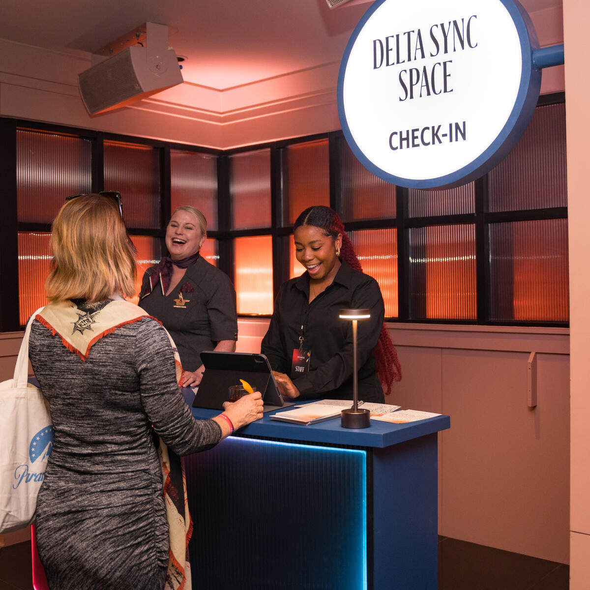 A Delta Lounge goer checks in to the Delta Sync space, a dedicated experience that provided quieter moments for members to focus and immerse themselves in locally curated content.&nbsp;