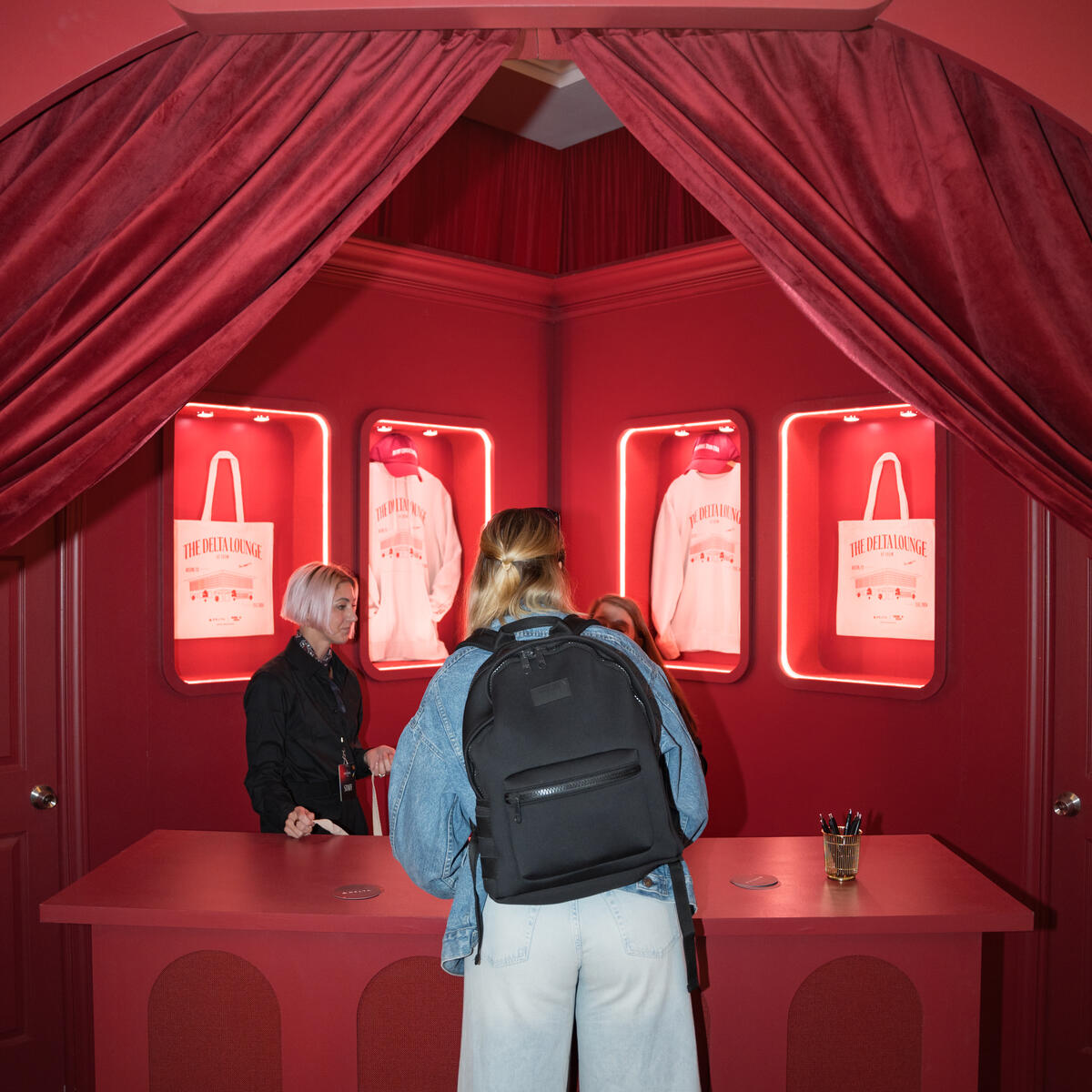 A SkyMiles member stops by the Gifting Salon in the Delta Lounge, an exclusive merch station where lounge goers were given a ticket to redeem custom limited-edition Delta x SXSW merchandise such as hats, tote bags and sweatshirts.