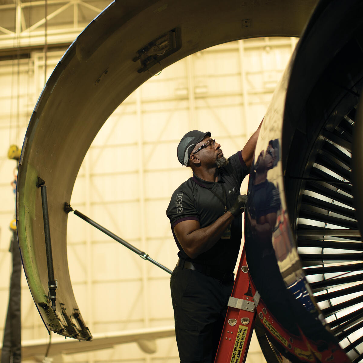 Cedric M. from Delta's TechOps team works on a Delta aircraft.
