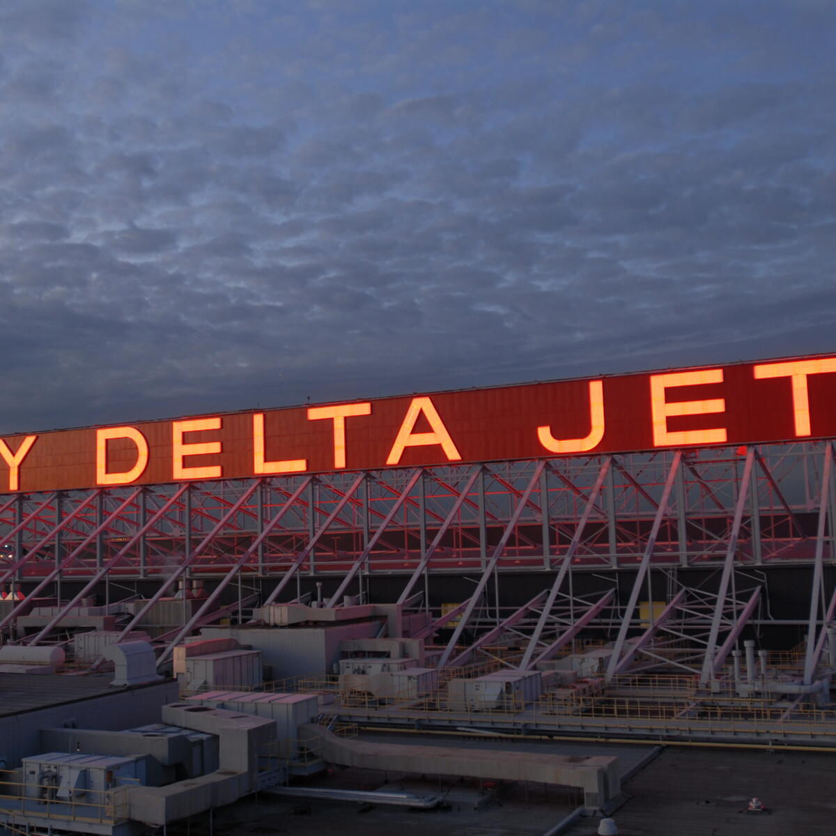 Lit up Fly Delta Jets sign at the Delta World Headquarters in Atlanta