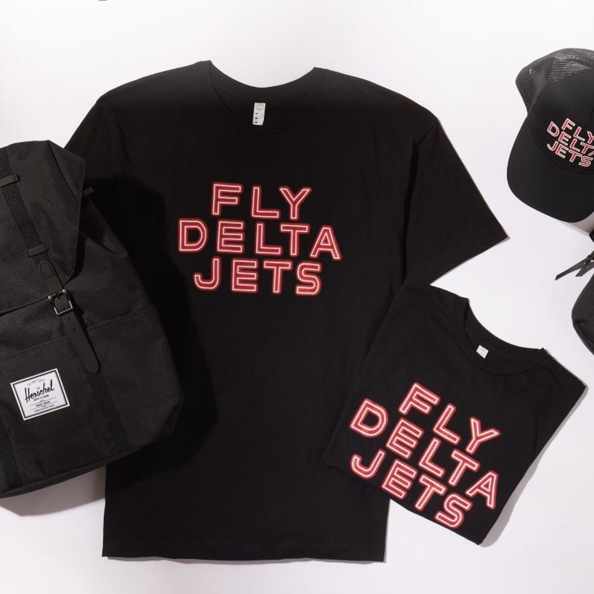 Fly Delta Jets logo on t-shirts and a hat along with the Delta widget on a backpack and fanny pack