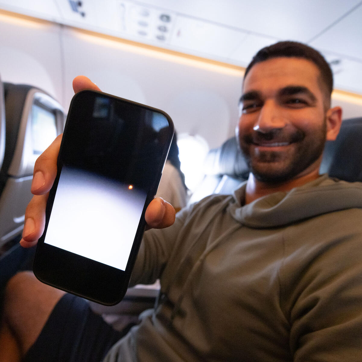 Customers on board DL 1010 from Dallas Fort Worth International Airport (DTW) to Detroit Wayne County Metropolitan Airport (DFW) view the solar eclipse.