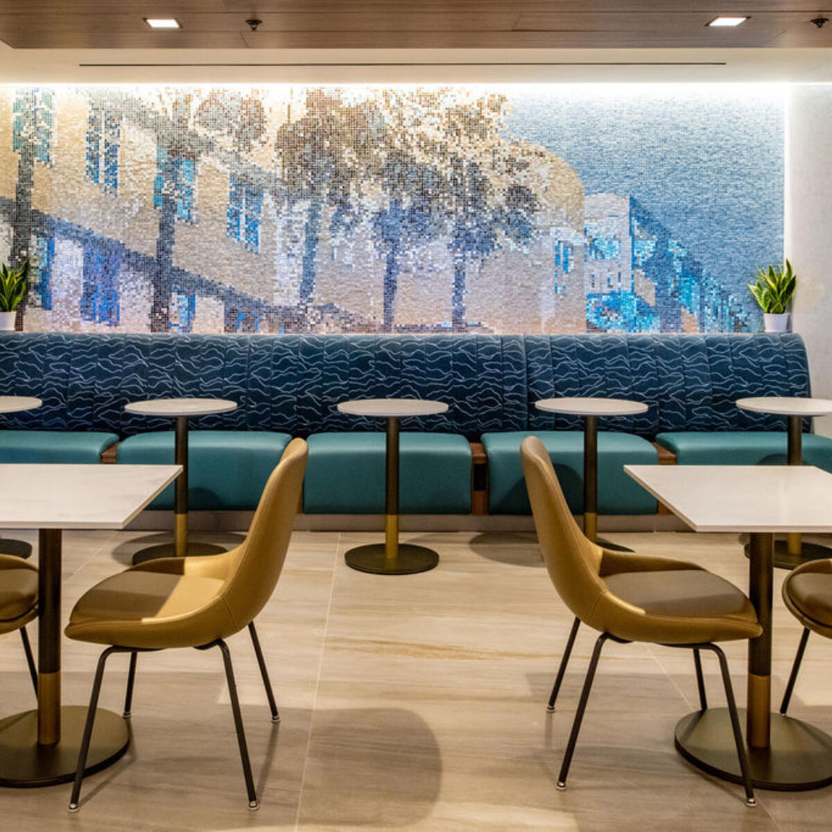 A new mosaic pays homage to the city’s classic Art Deco architecture, while the overall color palette reflects the nearby turquoise waters, blue sky, and white and gold accents seen in south Florida designs. 