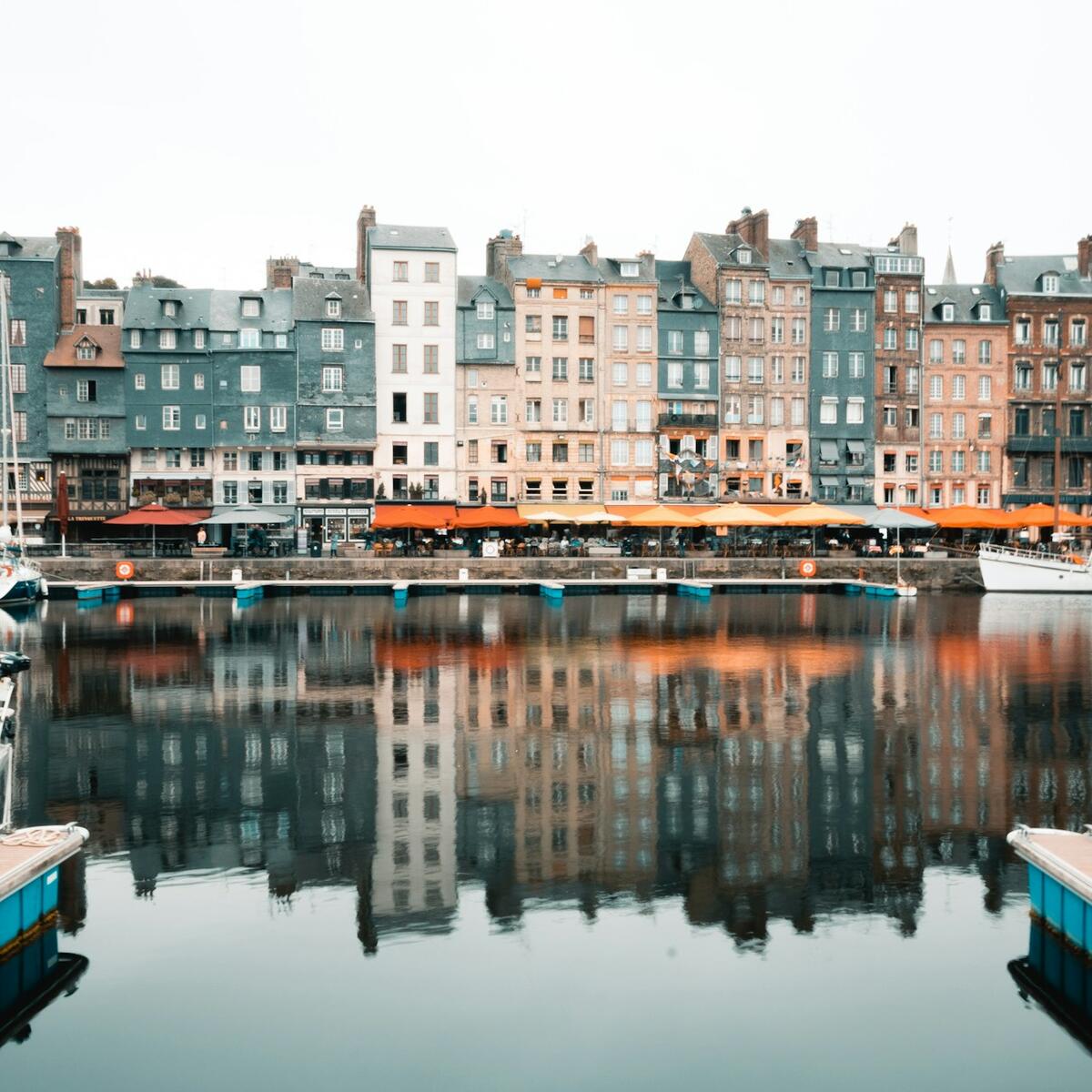 Colorful half-timbered houses line the picturesque harbor in Honfleur.
