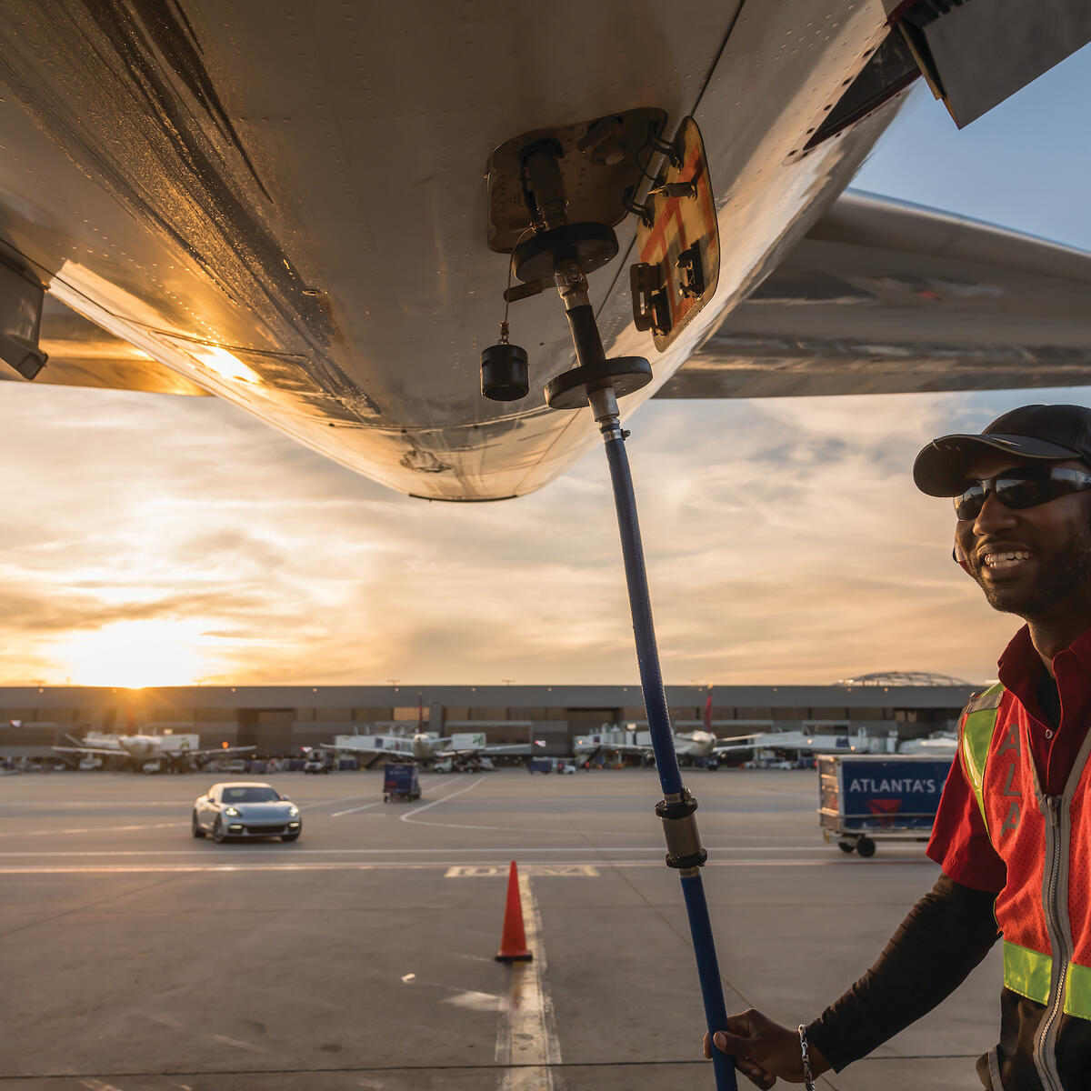 Ramp agent working under an aircraft