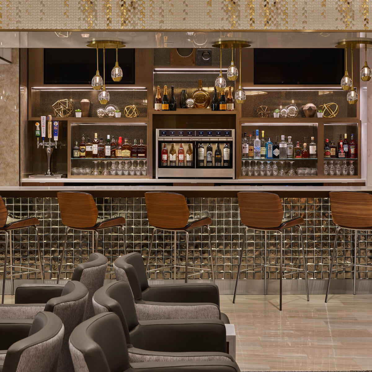 The Delta Sky Club at Detroit Metropolitan Airport features a premium bar that provides guests with access to complimentary beverages as well as upgraded options like premium wines, spirits, beer and signature cocktails. 