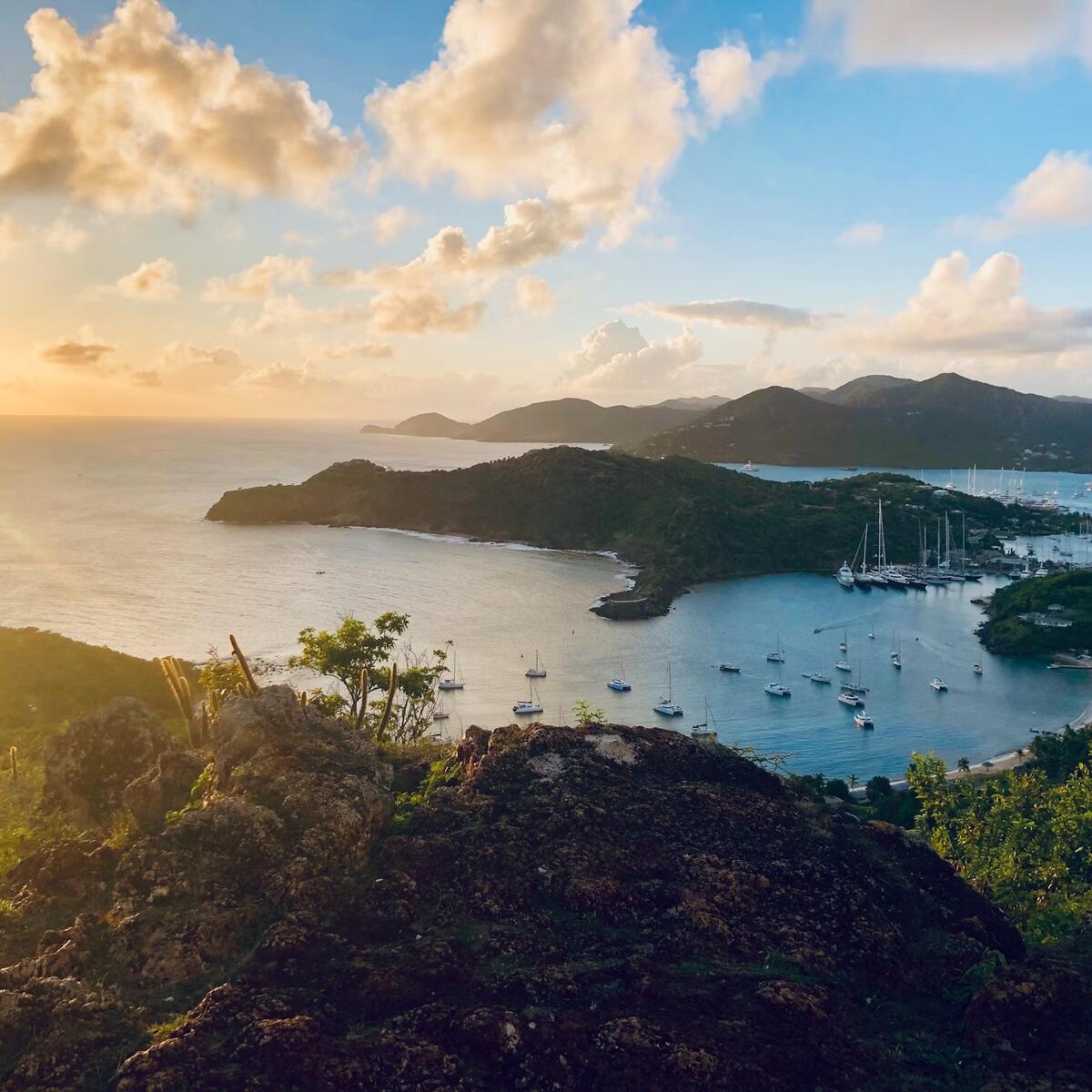 A bay filled with boats during sunset in the Caribbean island of Antigua and Barbuda