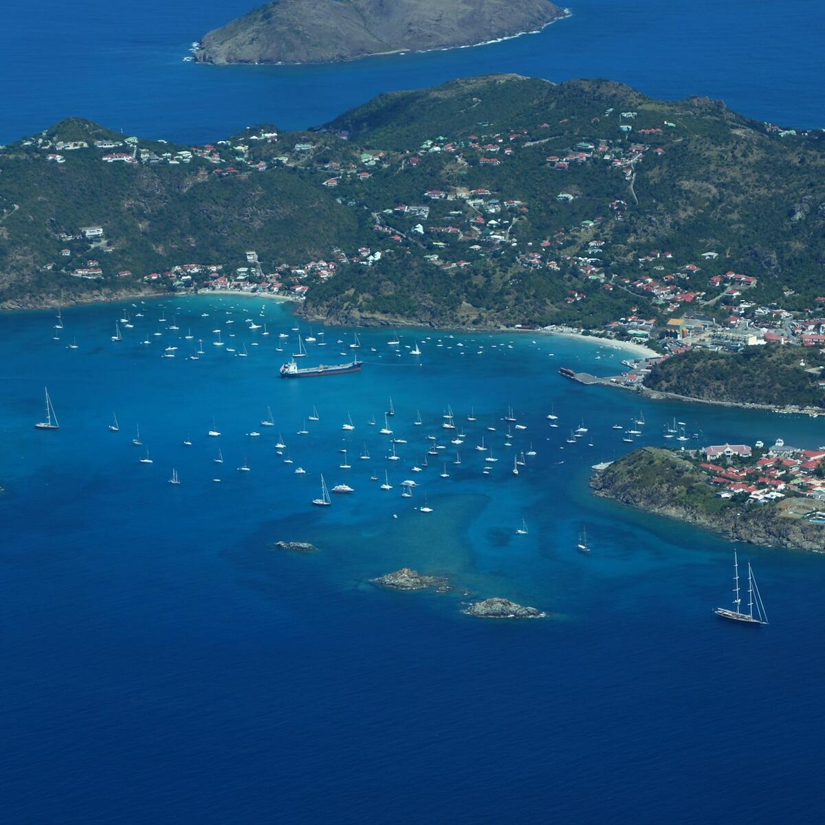 An aerial view of St. Kitts and Nevis with several yachts