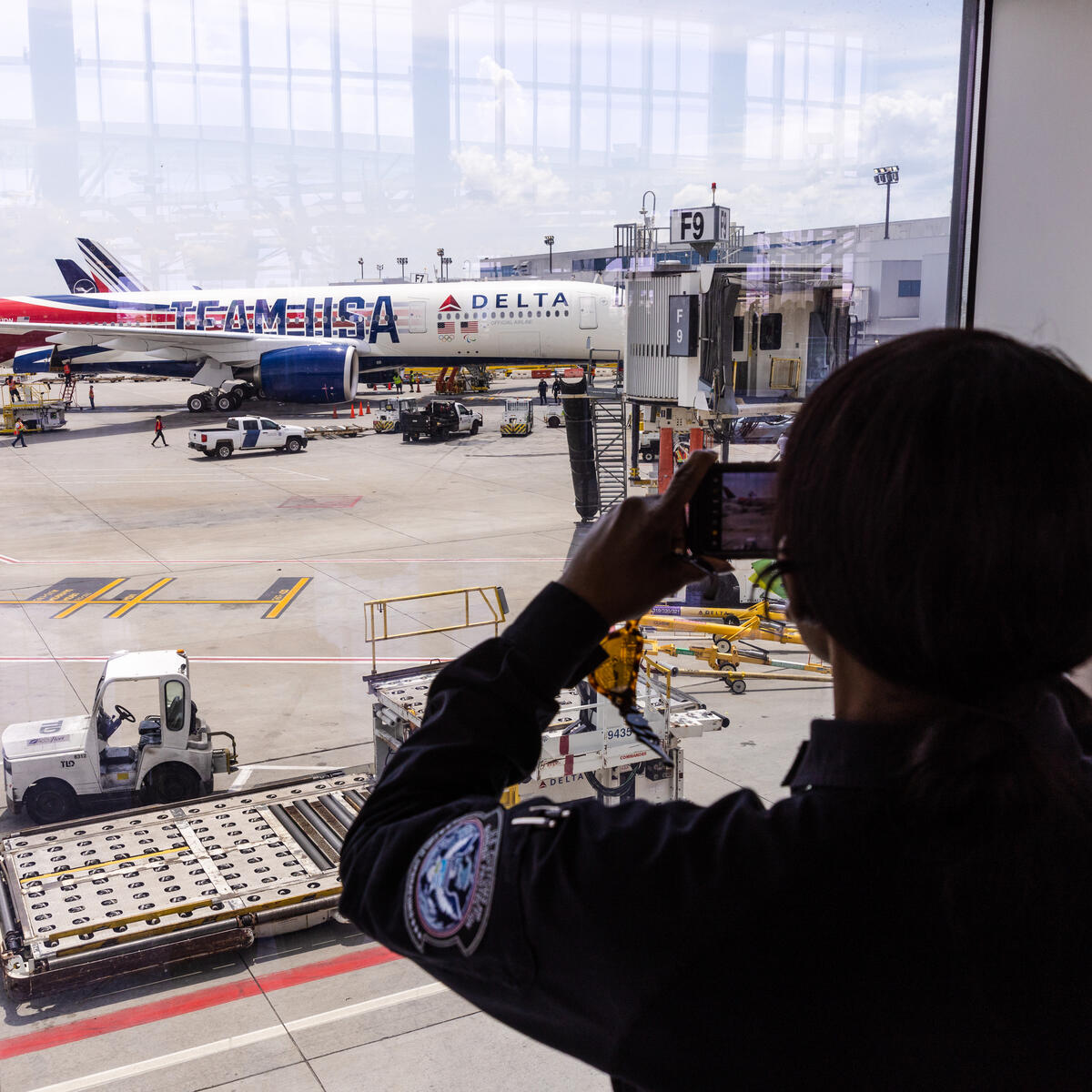 Someone takes a photo of Delta's Team USA plane as it lands in Atlanta, Georgia.