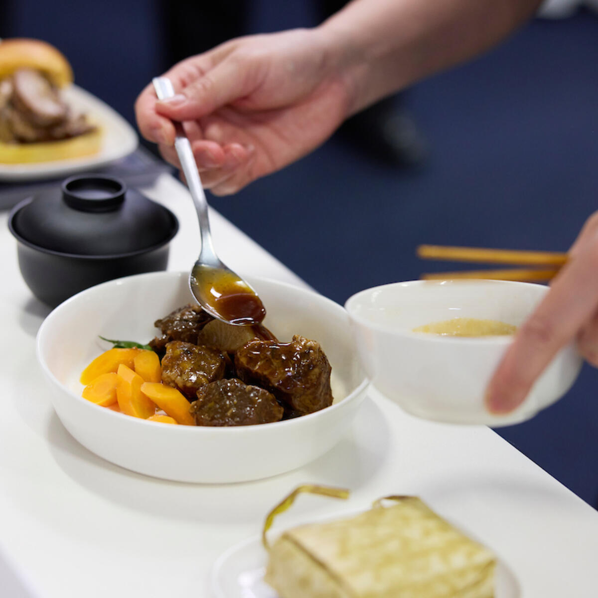Chef Jereme Leung prepares Asian classics for Delta One service