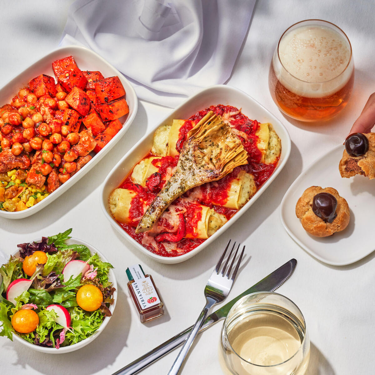 Makhani chicken curry with tomato chickpea stew and three-cheese manicotti with Bianco DiNapoli tomato sauce