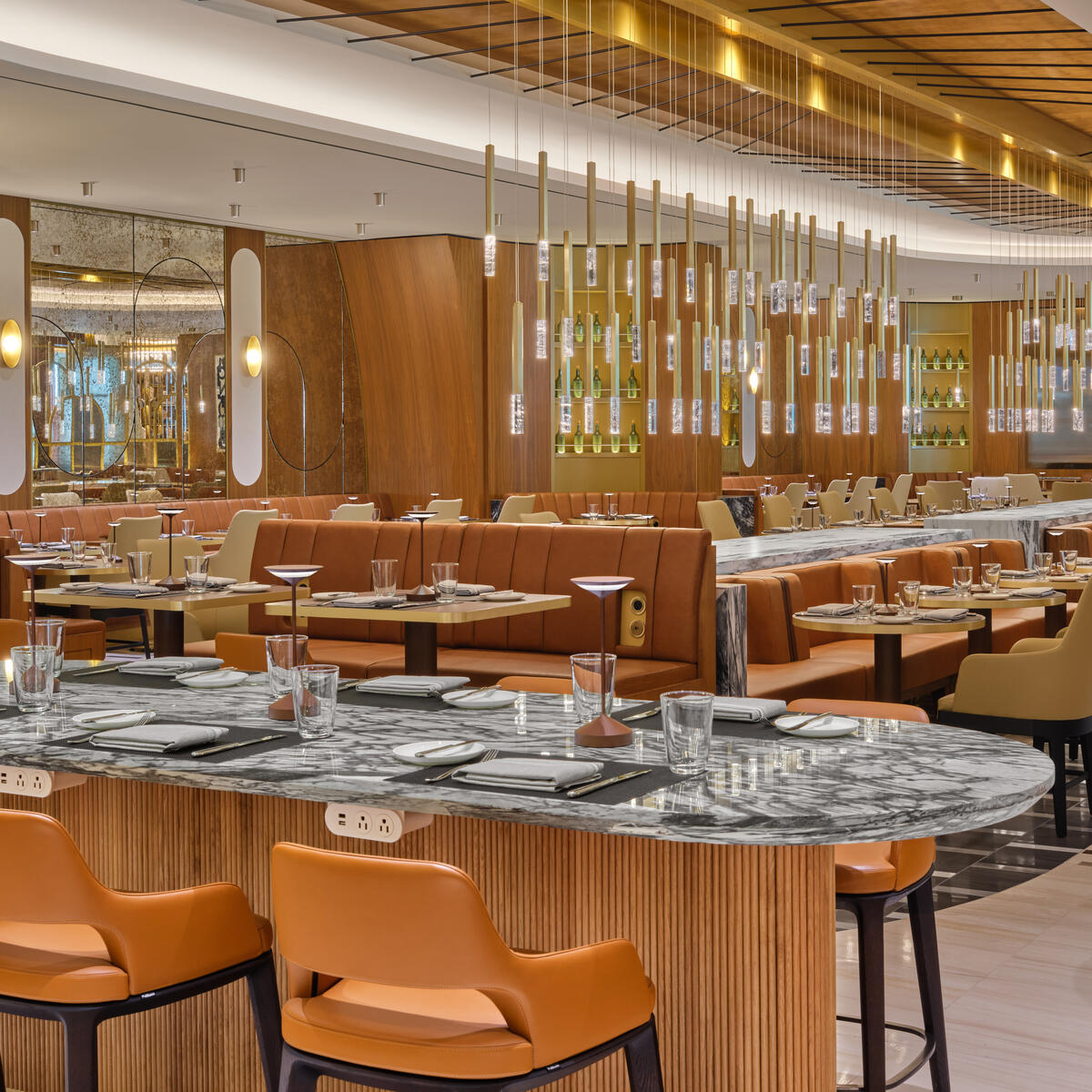 The iconic overlapping strands of the Brooklyn Bridge provided inspiration for the suspended lighting fixture in the dining room at The Delta Lounge-JFK.