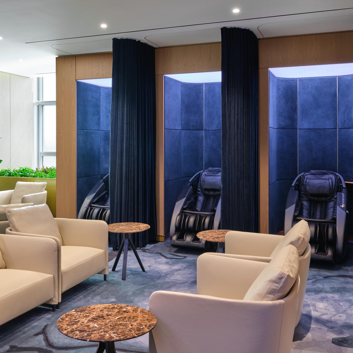 Prepare for the journey ahead in the designated wellness area, equipped with nine reservable relaxation pods with full-body massage chairs and nap chairs, treatments from Grown-Alchemist certified therapists, and more.