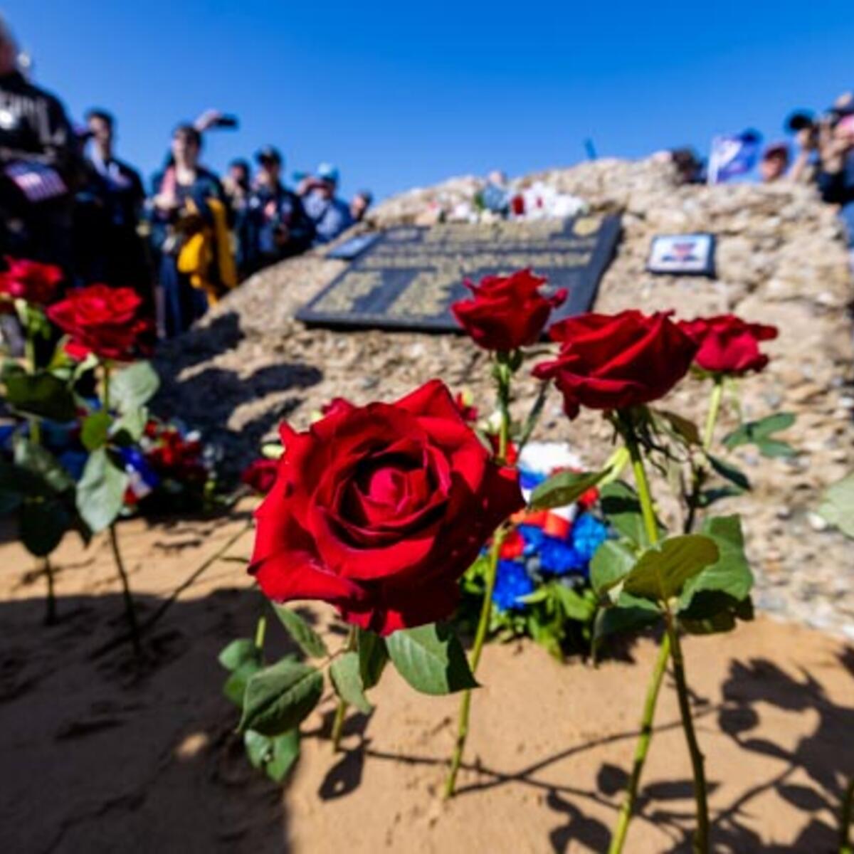 After signing countless autographs, the veterans enjoyed a ride on World War II-era vehicles to Omaha Beach, where they laid roses to remember comrades who lost their lives on those shores.