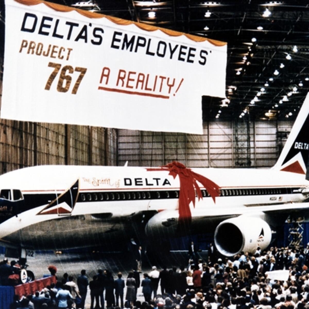The Spirit of Delta plane sits below a large "Project 767" banner.