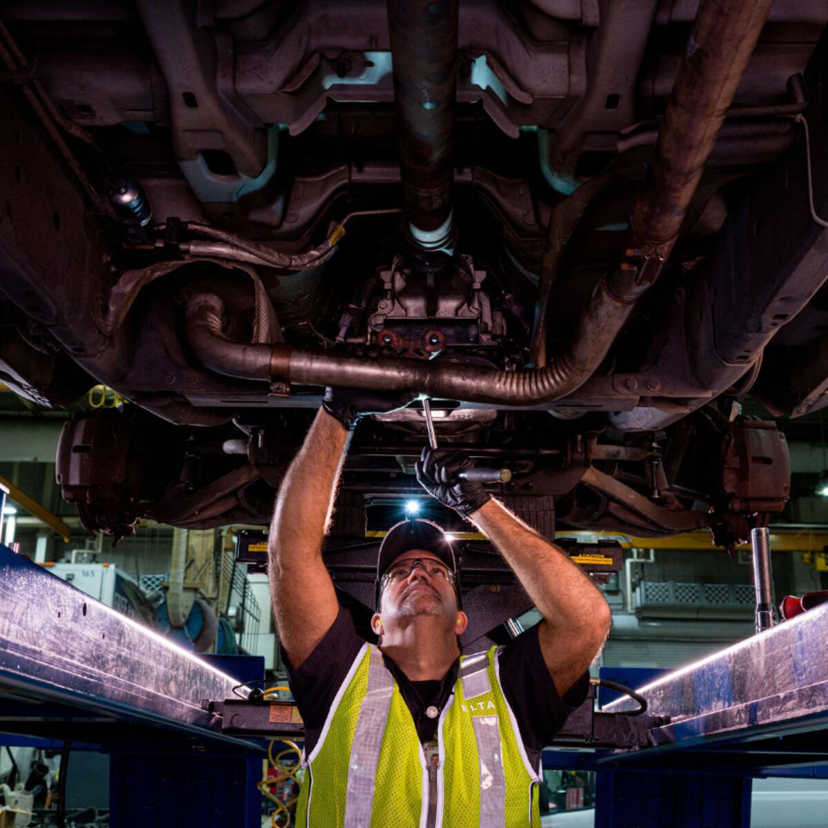 A member of Delta's Ground Support Equipment team helps maintain machinery.