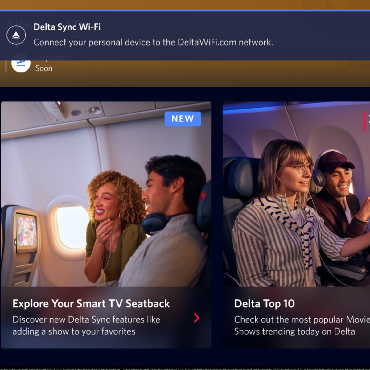 A seatback screen shows a notification informing passengers that fast, free Wi-Fi is available for their personal devices. 