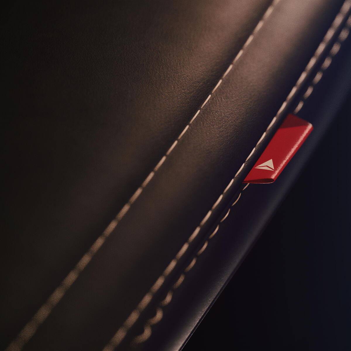 A close-up detail shot of the dress cover for Delta's cabin interior redesign