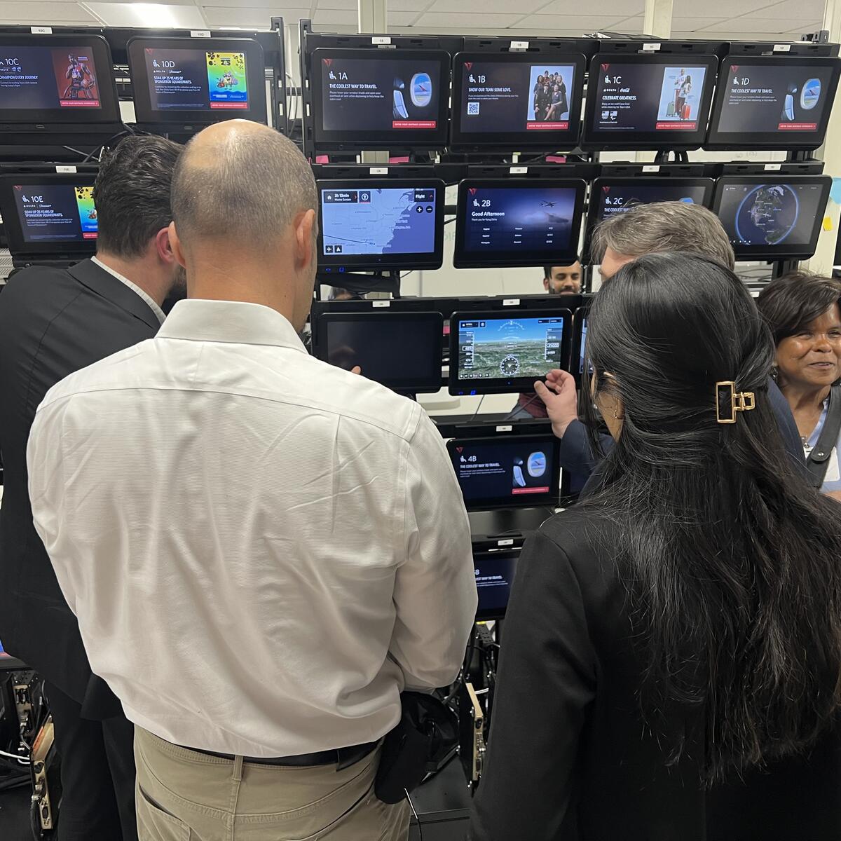 Members of the Advisory Board on Disability test Delta's new flight map in the In-Flight Entertainment lab.