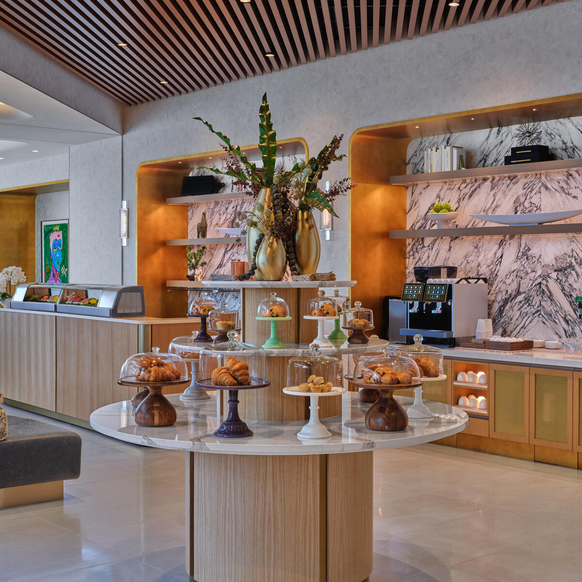A central multi-tiered table at the Delta One Lounge at LAX will house desserts and savory bites.