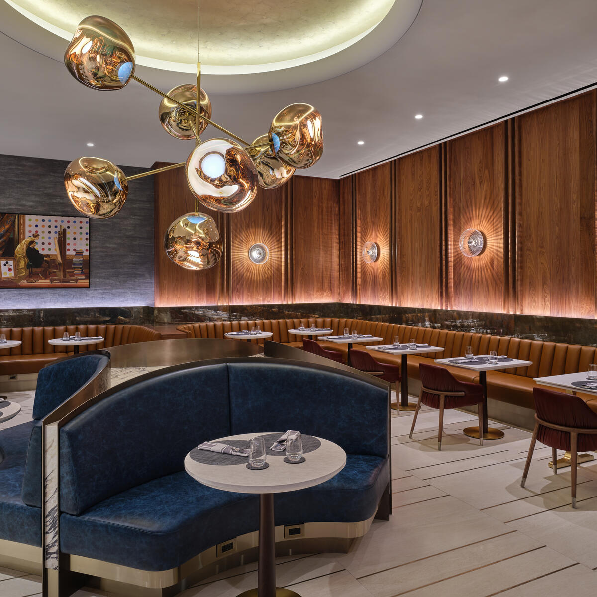 The dining room features lighting that nods to the glamour of old Hollywood. 
