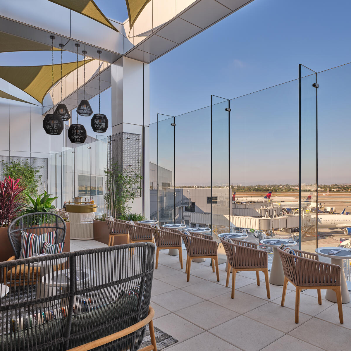 The landscaped terrace, featuring seating for 26, includes accent pillows furnished by Delta One luxury brand partner Missoni. 
