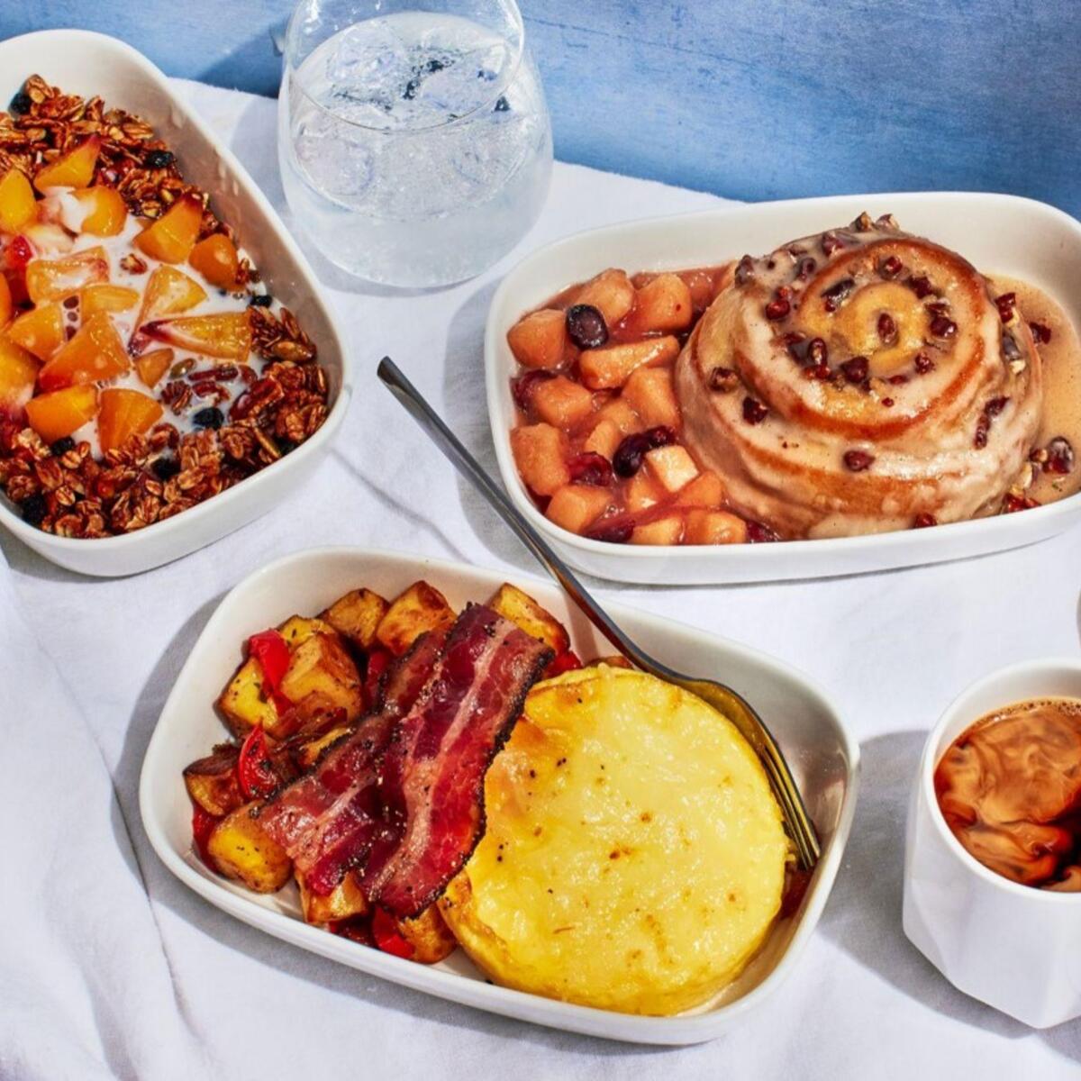 Breakfast, lunch and dinner options curated by Chef Mashama Bailey on domestic First Class flights where meal service is offered out of Atlanta. For breakfast, rise and shine with bacon and eggs with homestyle potatoes and white cheddar cheese; pecan honey bun with apple-cranberry compote; or Grey Market pecan granola with peach compote and almond milk. 
