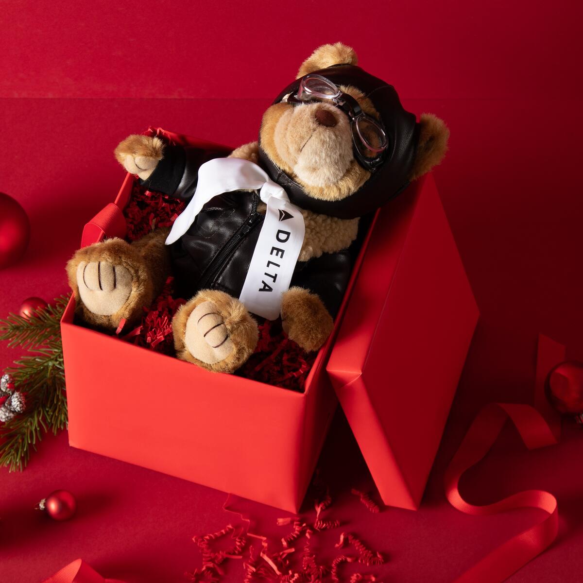 Our aviation teddy bear is the perfect, cuddly gift for the avid traveler in your life. In its faux-leather flight jacket and goggles, this bear is ready for any adventure! 