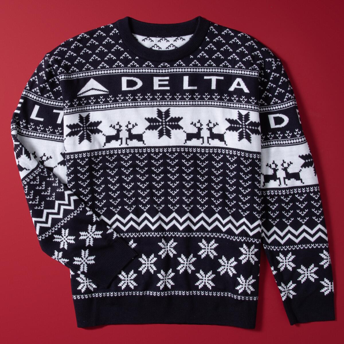 Show off your love for travel this winter with our Navy Delta Holiday Sweater. Cozy and colorful, this sweater is perfect for any festive occasion. 