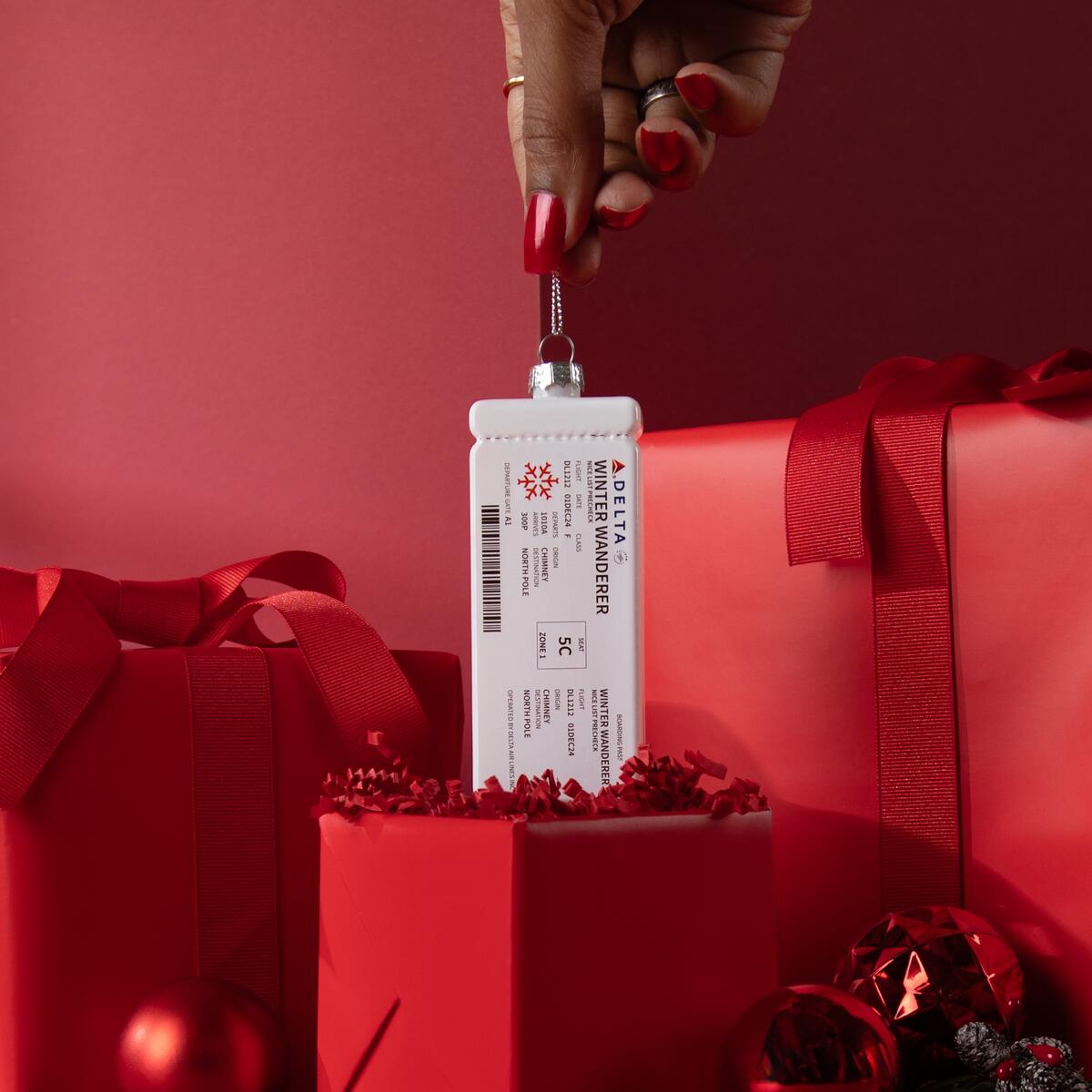 The holidays are now boarding. Spruce up your tree with our glass, Delta Boarding Pass ornament. Take a close look at the ticket information for fun nods to the holidays.  