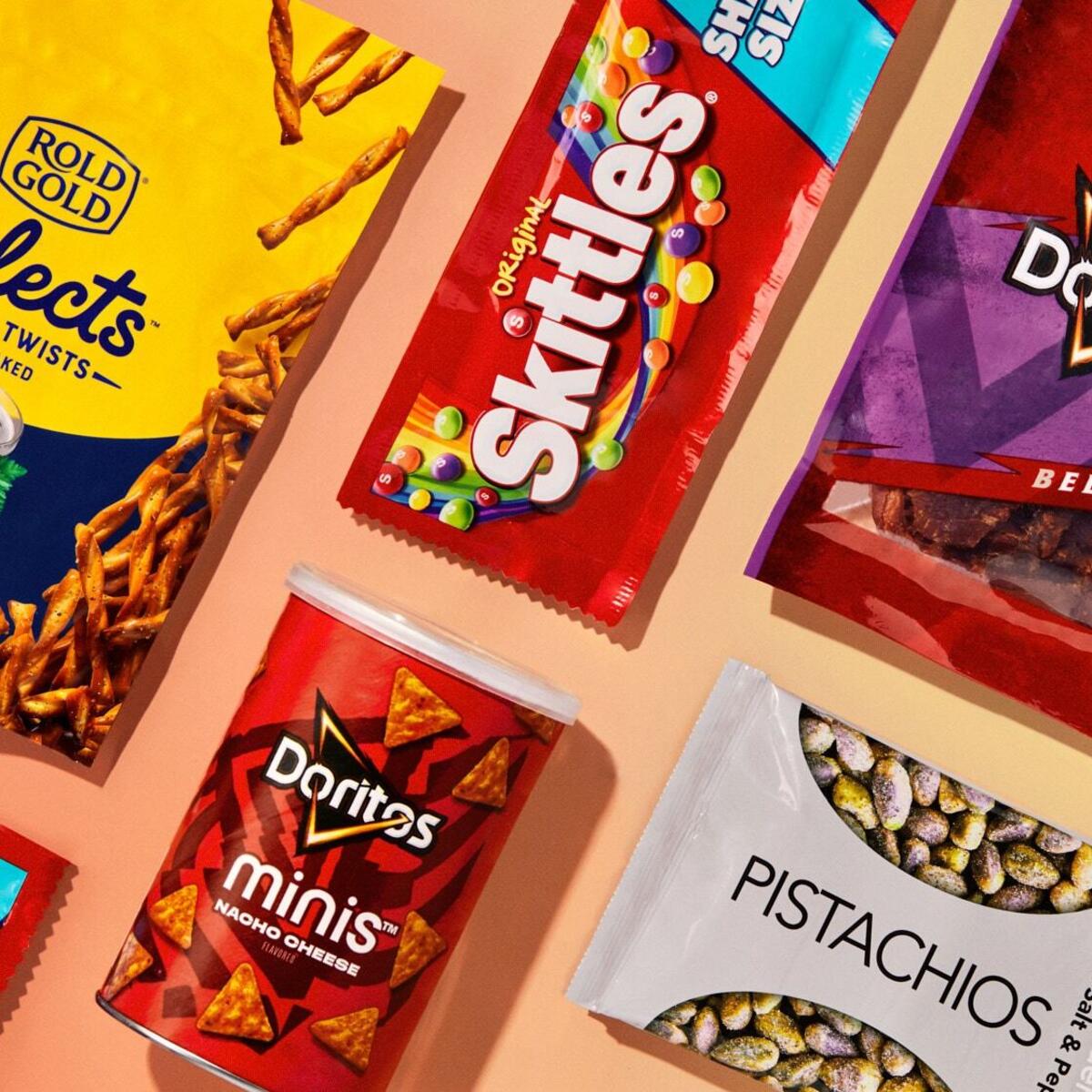 A flatlay of snacks available for purchase on board Delta flights