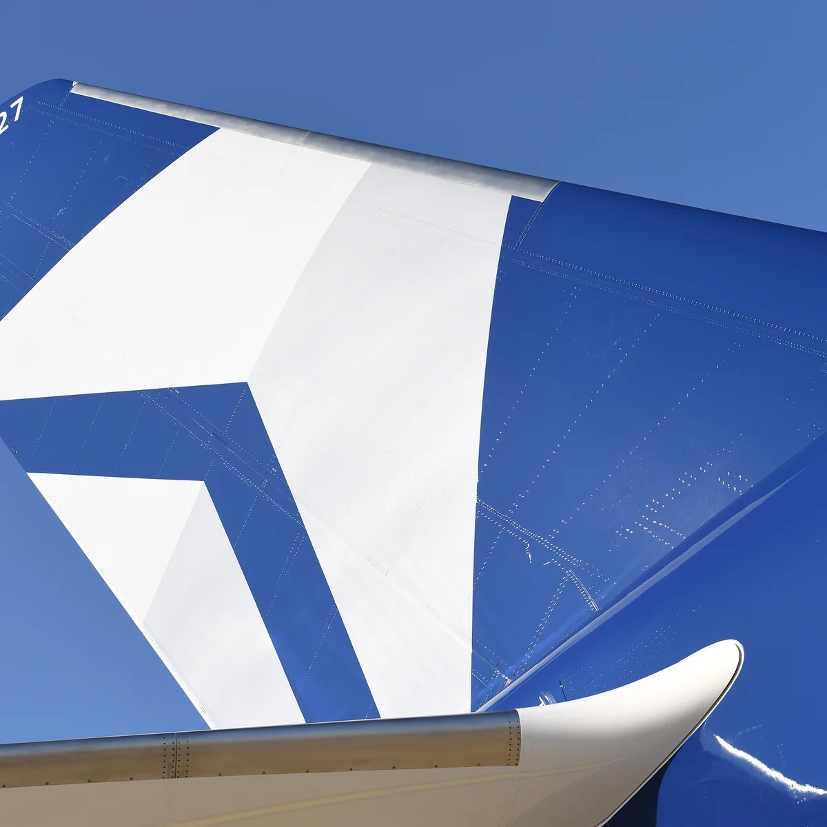 The tail of Delta's Centennial livery, which features the airline's Centennial colors: blue and silver.