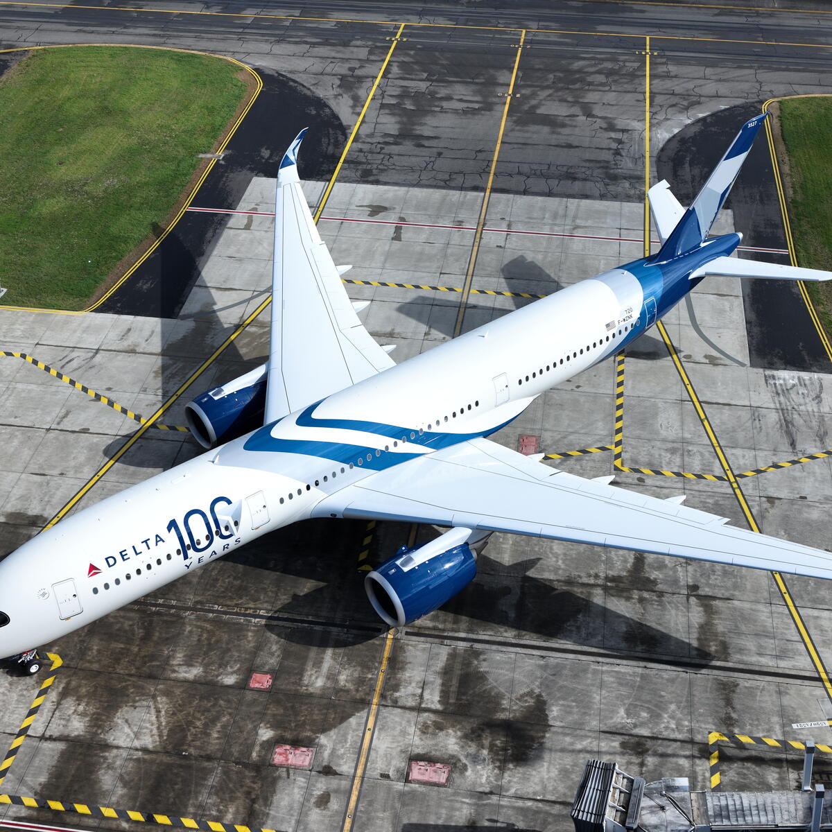 A drone view of Delta's Centennial livery, which features swooping designs and a bold 100 emblem.