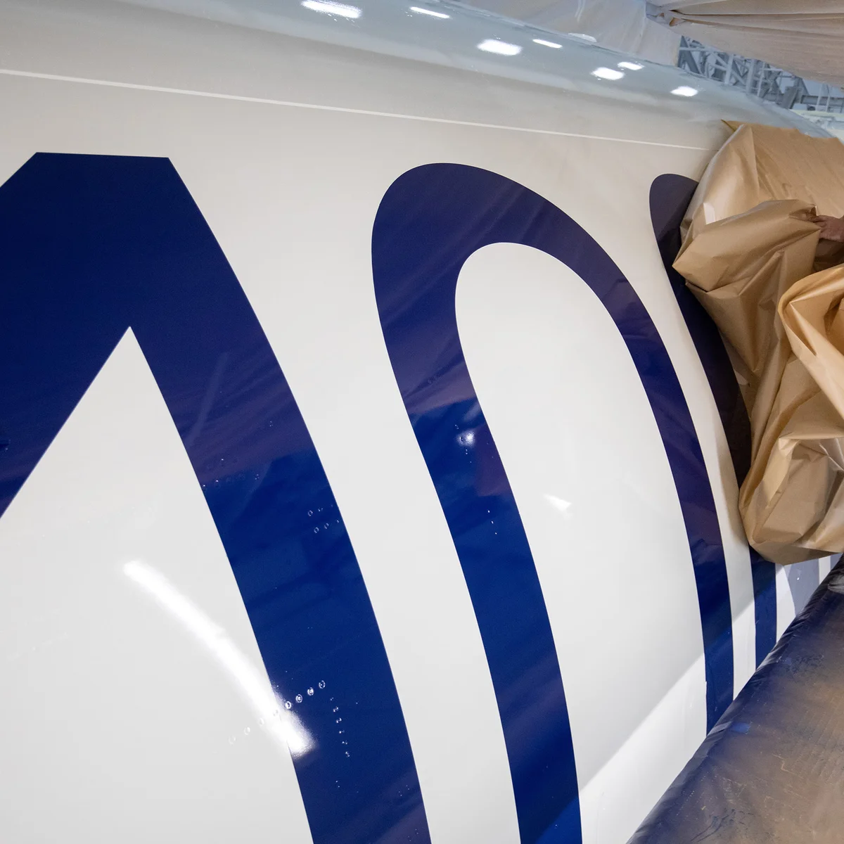 A bold 100 emblem is unmasked for Delta's Centennial livery.