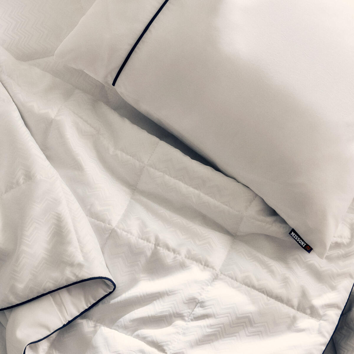 The new Delta One bedding set will include the Missoni duvet and white sleeping pillow, which feature a subtle and elegant Missoni zigzag design and navy accents. 